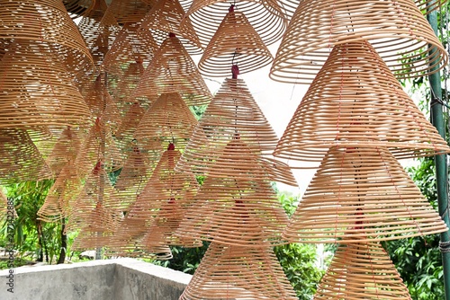 Obraz na plátně Close up view of traditional spiral incense coils hanging under a canopy roof in