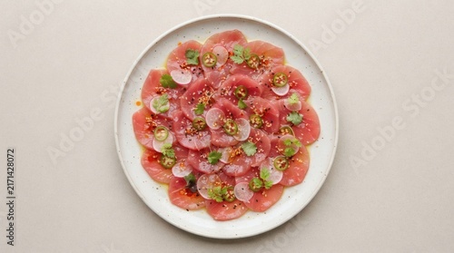 Overhead Flat Lay Raw Ahi Tuna Crudo Arranged Overlapping Rounds Plate Isolated Neutral Surface

