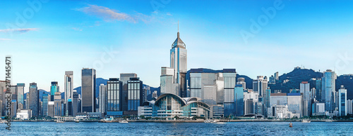 Panoramic view of Victoria Harbour and the Wan Chai skyline in Hong Kong, featuring Central Plaza and the Hong Kong Convention and Exhibition Centre.