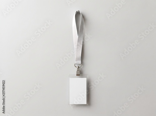 Clean and Professional Blank ID Badge Mockup with White Lanyard and Metal Hook on a Neutral Background, Perfect for Corporate Branding and Event Identification