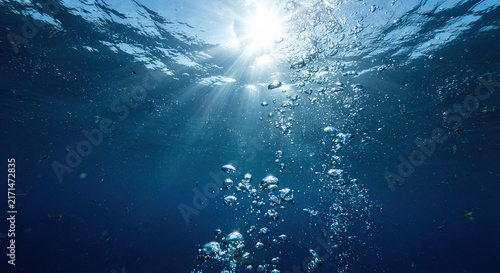 Sunlight Streaming Through Clear Blue Ocean Underwater