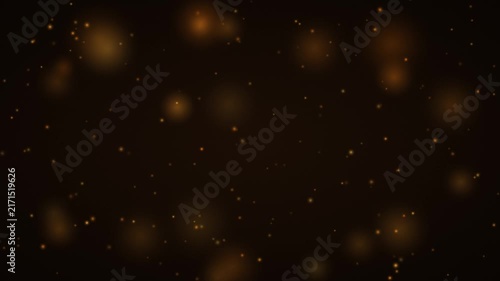 Golden dust particles floating on black seamless loop background