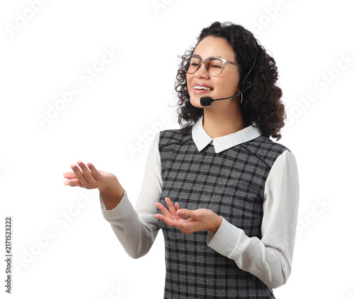 Female African-American online business consultant in headset talking on whit...