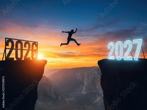 Silhouette of a person jumping across a canyon from 2026 to 2027 at sunset