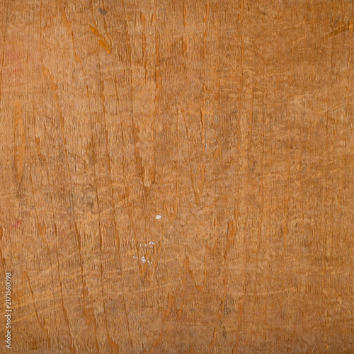 Scratched plywood surface with natural wood grain