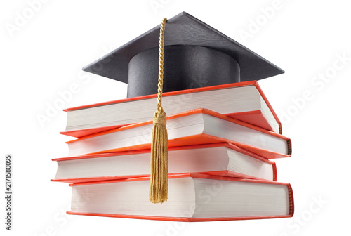 Fotografie Graduation Cap with Golden Tassel Resting on a Stack of Academic Books