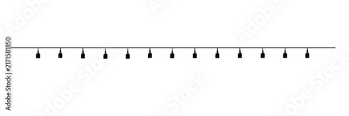 Black string lights hanging on a wire against white background