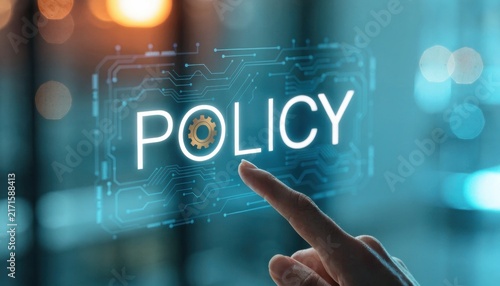 Finger touching a glowing digital screen displaying the word policy