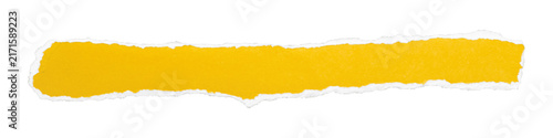 Long yellow paper strip with jagged torn lower edge