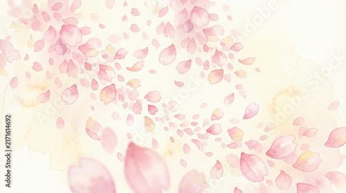 Soft pink cherry blossom petals falling and flying in the air on a light background