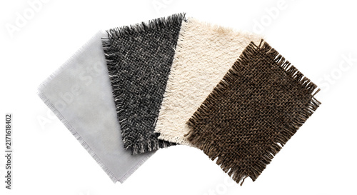 Konstfotografi Overlapping frayed fabric swatches in monochrome and earth tones