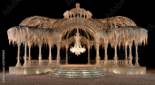 Intricate ice sculpture display in winter setting at night