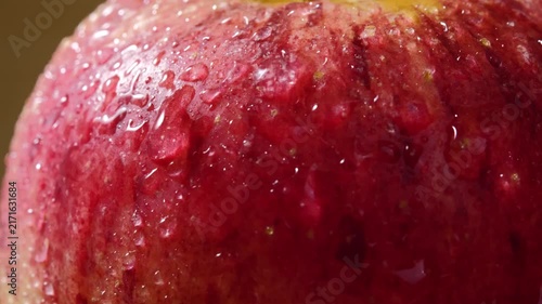 Close-Up of Red Apple Covered with Water Droplets	
