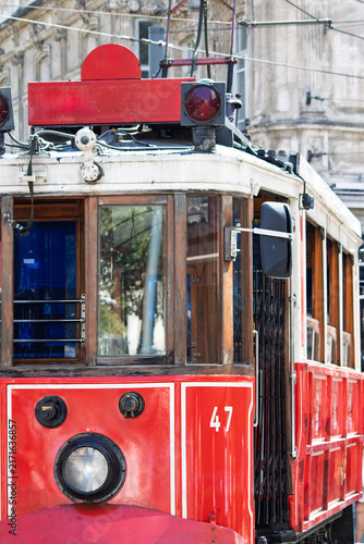 Nostalgic red tram. The classic red tram on Istiklal Avenue in Taksim. Istanbul's famous or popular tourist destination. Rail transport vehicles. No people, nobody. Vertical photo.