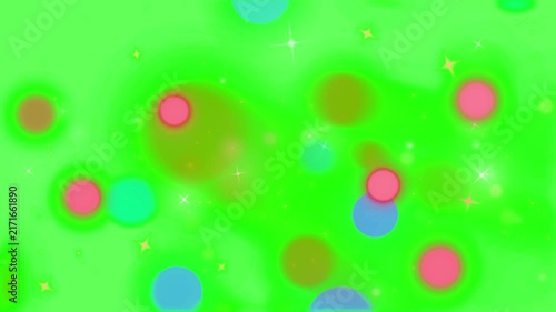 Colorful glowing bokeh circles and tiny star lights drift across a vibrant green chroma key background.