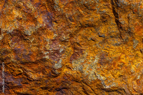 Obraz na płótnie Close-up Textured Iron Rock Surface with Orange and Brown Hues