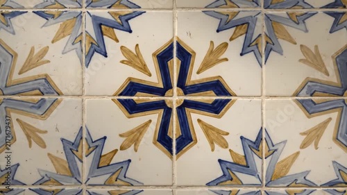 Decorative ceramic tiles with blue and gold geometric cross patterns