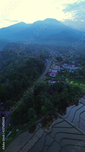 the beauty of the foggy morning panorama with sunrise and rice fields in Bengkulu, indonesia, asia