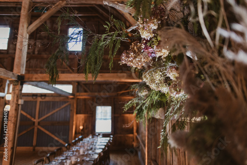 Canvas Print Hanging floral centerpiece at rustic barn reception