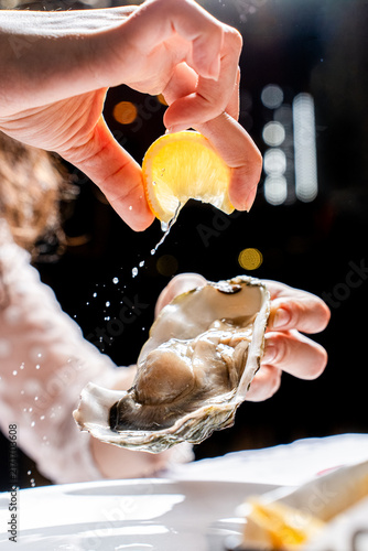 Lemon Juice Splashing on Fresh Oyster