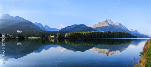 Lake Sils and the Chaste island in the morning with reflection in Sils Maria / Segl, St Moritz, Canton Grisons, Switzerland