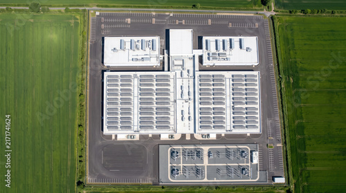 Aerial top down view of a large data center with solar panels