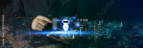 Business professional using an AI agent with voice commands and prompts to automate workflows, analyze data, support coding, and improve productivity through intelligent digital technology.