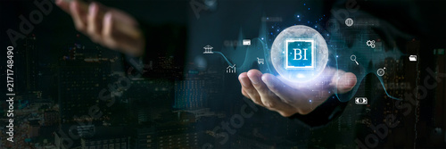 Global business intelligence concept featuring a glowing BI interface over a modern city. Represents data analytics, global business, smart decision making, financial insights and digital transformati