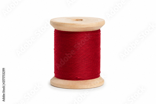 Red Cotton Sewing Thread on Wooden Spool Isolated on White