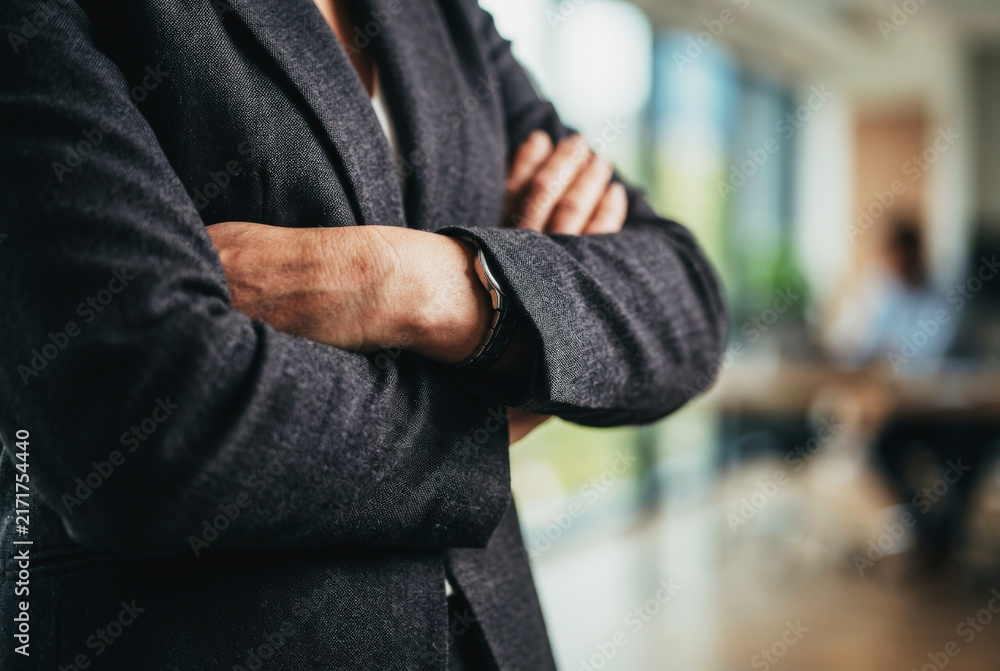 Fototapeta premium Professional person with arms crossed in office