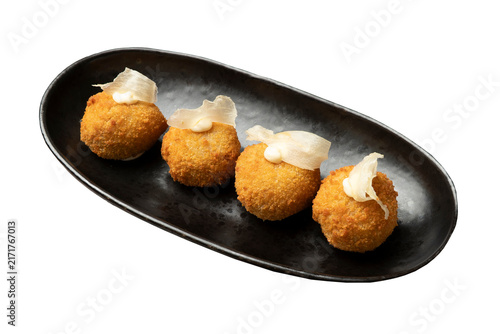 Foto Golden fried croquettes on black plate with transparent background
