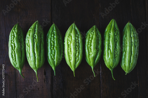 Konstfotografi Fresh bitter melons on the dark background