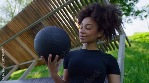 Smiling Athlete Balancing Basketball On One Hand