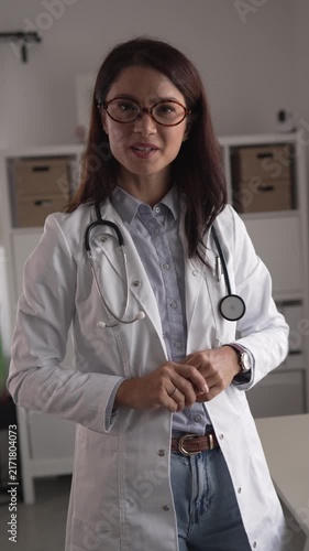 Professional female doctor speaking to camera