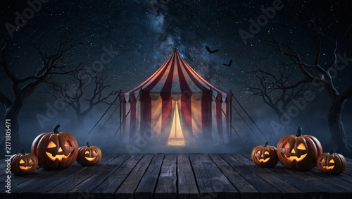 Halloween Pumpkin Circus Tent Under Starry Night Sky with Bats