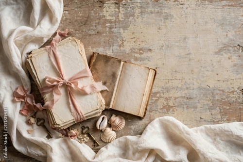 Vintage Open Book and Dried Botanicals on Rustic Wood Surface