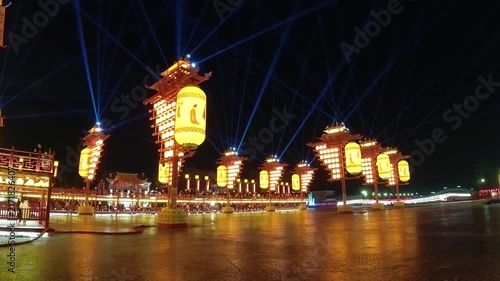 A beautiful view of giant lanterns in the style of China's Tang‑Dynasty lit up in a park, Tangshan City, China
