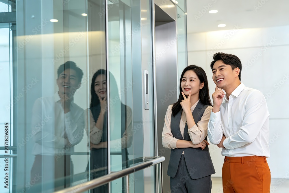 Fototapeta premium Business Man Woman Standing Glass Wall Looking Up Smiling