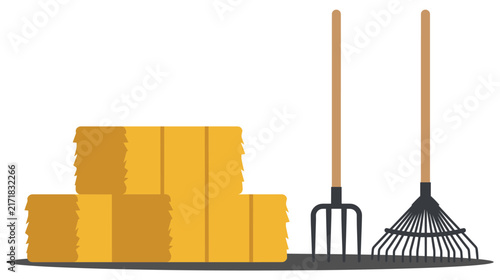 Картината върху платно Yellow straw hay bales pile next to metal pitchfork and rake farm tools