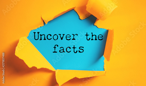 Photography uncover the facts text on paper