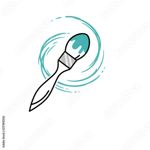 Paintbrush with teal paint and swirling lines