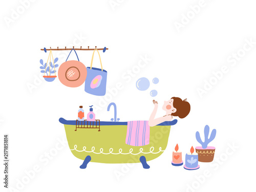 The woman is relaxing in a bathtub or taking time to pamper herself