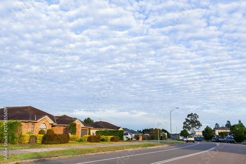 Quiet morning streetscape scene with dramatic Altocumulus clouds