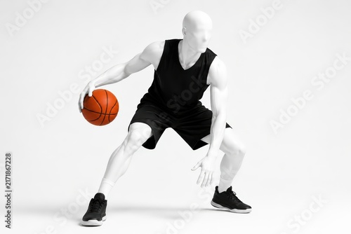 Dynamic Basketball Player Mannequin in Black Uniform in a Dribbling Stance Ready for Action on White.