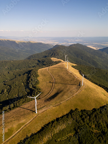 Aerial View of Wind Turbines Windmill Farm on Mountain Ridge at Sunset