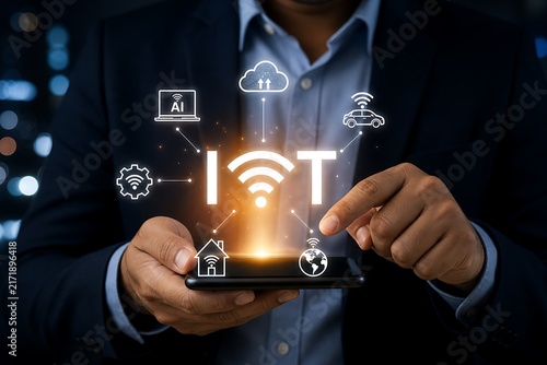 Hands holding smartphone with glowing iot symbol and connected device icons