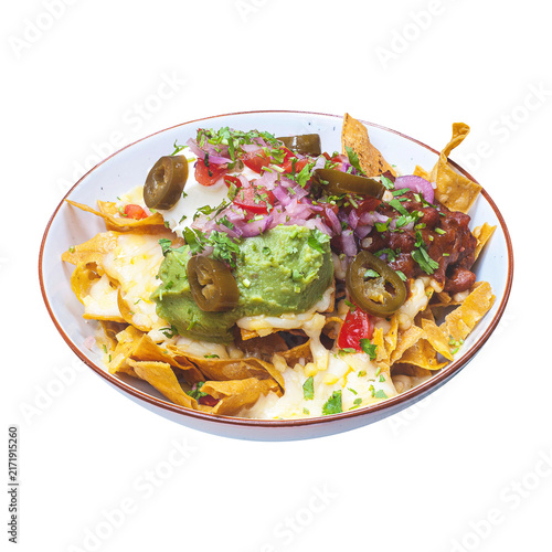 Cuadro en lienzo Crunchy corn tortilla chips smothered in melted cheese, topped with a generous dollop of guacamole, spicy salsa, sour cream, sliced jalapeños, and red onions