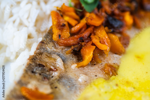 Canvastavla Detail of zander fillet, saffron sauce and rice.