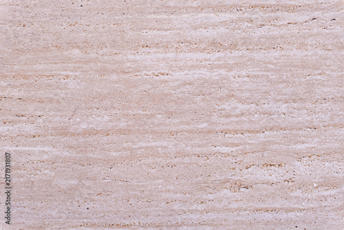 Obraz na płótnie Natural travertine stone surface displaying a warm beige and pinkish hue