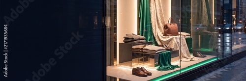 Luxury menswear display in a modern storefront